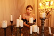 © Сергей Луговский - Portrait of young beautiful woman with candles on vintage piano