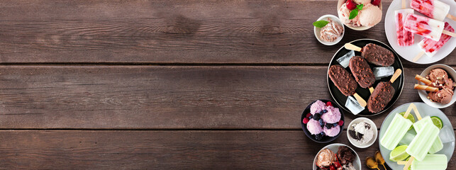 Aufkleber - Cool summer food side border. Assortment of ice cream bowls, popsicles and frozen treats. Overhead view on a dark wood banner background. Copy space.