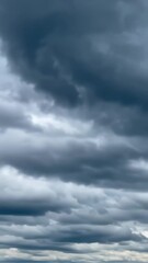 Wall Mural - Vertical video Dark storm clouds