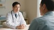 © xiangyanmeng - Doctor in a white coat consulting with a patient in a medical office setting.