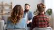 © MACKY - a counseling session with a professional consultant. The image shows a man and a child sitting facing a therapist. The therapist is focused and attentive, providing guidance and support.