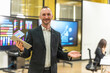 © Jack Tamrong - Male Caucasian businessman in suit holding tablet working in conference meeting room