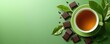 © Vergiliy - Tea and chocolate pairing on green background with fresh leaves and chocolate pieces