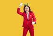 © Studio Romantic - Overjoyed woman feeling crazy and dancing carefree, enjoying Christmas holidays, having fun on New Year costume party, isolated over vivid yellow background. People and holiday concept