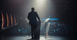 © Gorodenkoff - Business Leader Walking Out on Stage to Give a Talk at a Global Finance Summit. Audience Listening to His Insightful Talk. Speaker Standing with His Back to Camera While Making a Motivational Speech