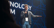 © Gorodenkoff - Visionary Young Public Keynote Speaker Delivering a Motivational Speech on Stage, Hosting a Tech Startup Seminar to Help Entrepreneurs Overcome Their Professional Challenges