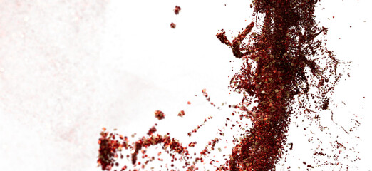 Poster - Red glitter particles exploding on white background. Perfect for festive designs, cosmetics, and more.