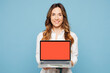 © ViDi Studio - Young employee IT business woman corporate lawyer wears shirt classic formal clothes work in office hold use showing blank screen area laptop pc computer isolated on blue background studio portrait.