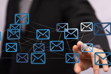 Poster - Image of a businessman interacting with a network of email icons. Represents global communication and digital marketing.