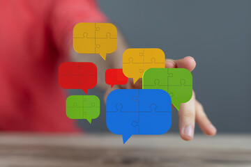 Aufkleber - Colorful puzzle pieces in speech bubbles represent teamwork, communication, and problem-solving.