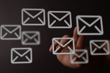 Poster - Hand interacting with email icons, illustrating inbox management and digital communication.