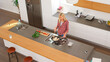 © Monkey Business - Overhead View Of Woman Preparing Meal Modern Kitchen