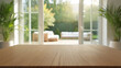 © Mamun Design - Empty Wooden Tabletop With Blurred Background Of Patio And Garden View