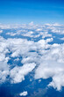 © Vieille Prune - View of the blue sky with white clouds from an airplane window at high altitude
