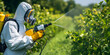 © fun_pic - Agricultural Worker Spraying Orchard Trees with Protective Gear for Crop Protection and Pest Control Marketing Photography