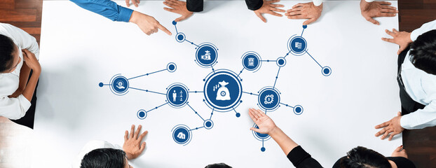 Aufkleber - A dynamic teamwork scene displaying hands around a table engaged in strategy and reduction techniques for business innovation and efficiency in modern corporate environments. Amity