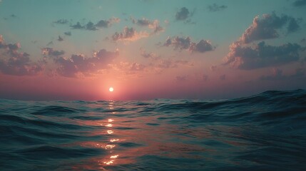 Wall Mural - a stunning sunset over a tranquil body of water as clouds scatter across the blue sky and the golden