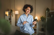 © Miljan Živković - Mature adult woman buy online on mobile phone and use credit card