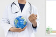 © poko42 - 地球儀を持ってガッツポーズする医者のイメージ（日本人、男性、顔無し、30代）