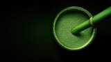 A detailed view of green powder in a bamboo cup
