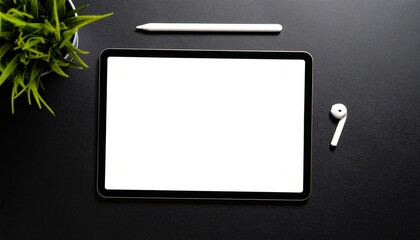 Tablet with blank screen on black matte surface