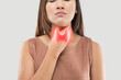 © eddows - A woman is depicted holding her throat, with a superimposed image of the thyroid gland, suggesting clinical relevance to thyroid dysfunction or examination.