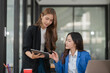 © Thitisak - Two young female businesswomen are meeting in an office