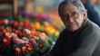 © ek - Elderly Man with Glasses Surrounded by Colorful Flowers at Market