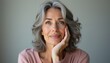 © natakot - Thoughtful woman with silver hair gazing into the distance