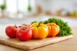 © Lush Diaries - Fresh, ripe tomatoes and bell peppers sit on a wooden cutting board in a bright kitchen.  Healthy eating concept.