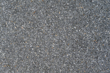 Aufkleber - Granular dark grey abrasive texture forms detailed close up surface background. Uniform rough pattern material appears across full frame ideal for graphic design
