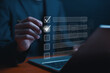 © C VrStudio - Business performance checklist concept, Businessman using laptop take an assessment, An businessman checklist online survey filling form list options business employee security procedures.