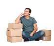 © 1STunningART - Pensive young man seated on the floor and leaning on cardboard boxes keeps hand under cheek and dreams. Ready for moving to a new house, transparent background