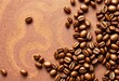 © Somnuek - Abstract swirling coffee bean pattern on textured background, roasted, cozy