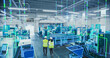 © Gorodenkoff - Two Engineers in Safety Gear Use a Tablet to Interact With Holographic Data in a High-tech Factory, Surrounded by Advanced Machinery and Digital Interfaces, Illustrating a Futuristic Manufacturing