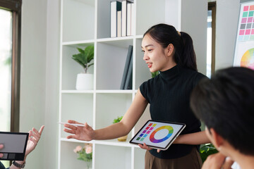 Wall Mural - presenting ux ui concepts. a designer showcasing a digital design to the team.