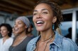 © Milos - A joyful woman with curly hair leads her group in song, radiating happiness and connection in a natural setting, showcasing the power of community and shared experiences.