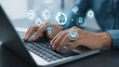 © Halina - Hands typing on laptop with digital business icons floating above symbolizing innovation and technology