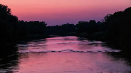 Wall Mural - beautiful sunset over calm river with purple and pink skies