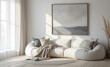 © Shootdiem - Home interior design of modern living room with large, rounded, off-white bean bag style sofa, pillows in shades of gray, beige, and white. Focus on soft textures and neutral tones