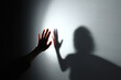 © Kim - Stark shadow looms large, hands reach out, expressing desperate fear
