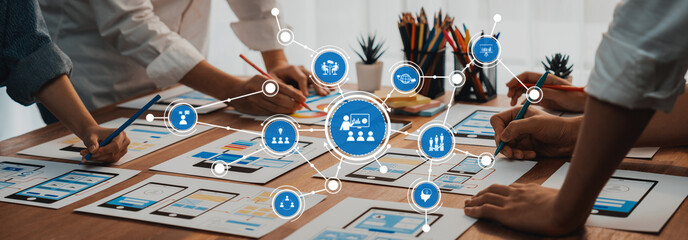 Leinwandbilder - Engaging scene showcasing hands working on design papers in a collaborative workspace, highlighting teamwork and the creative process with digital elements. Amity