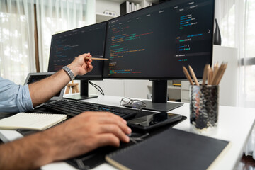 Cropped hands pointing of IT developer's data software development on pc, creating application program version online website page system showing to target customer, working at modern office. Surmise.