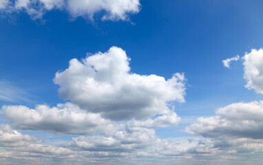 Wall Mural - a beautiful blue sky with soft, white clouds, for an abstract background