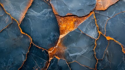 Poster - The image is of a broken piece of stone with a blue and orange color. The stone is in a cracked and broken state, with some pieces missing. Scene is one of destruction and decay