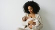 © Lari Rabello - Afro mother breastfeeding her baby