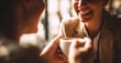 © Stock Pix - Warm coffee shared between friends creates a moment of joy. The woman smiles bright while holding a cup of joe.