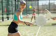 © JackF - Determined sporty young woman doing her best playing padel in court