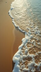 Poster - Beach meets the sea: Waves and sand create a mesmerizing abstract coastal scene.