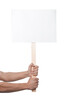 © New Africa - Man holding blank sign on white background, closeup. Mockup for design
